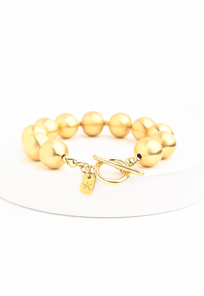 Ball Bracelet in Gold, Gives Freedom to Exploited Women!