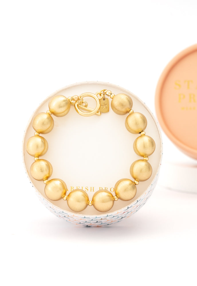 Ball Bracelet in Gold, Gives Freedom to Exploited Women!