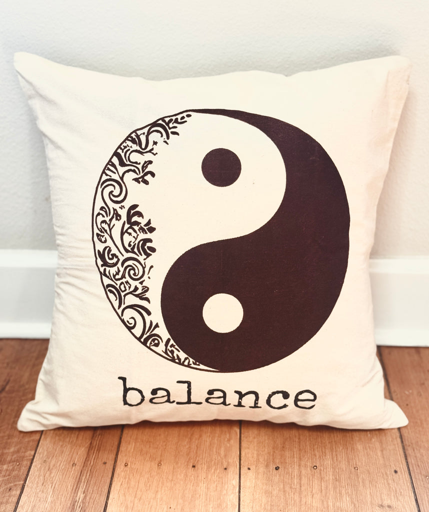 Decorative handmade cotton canvas 20" x 20" decorative pillow with yin yang symbol and the word 'balance'. Handmade by Survivors.