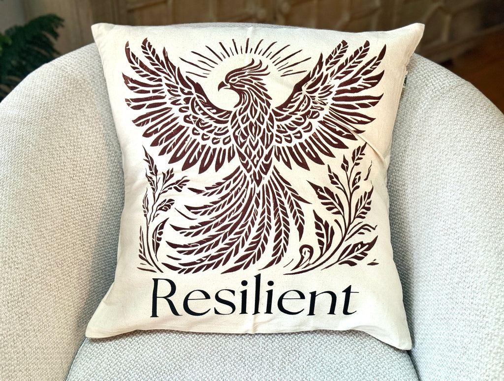20" x 20" Decorative cotton Canvas pillow with a Rising Phoenix design and the word 'Resilient'. Hand-sewn & Hand-printed by Women Survivors in Kolkata, India. 